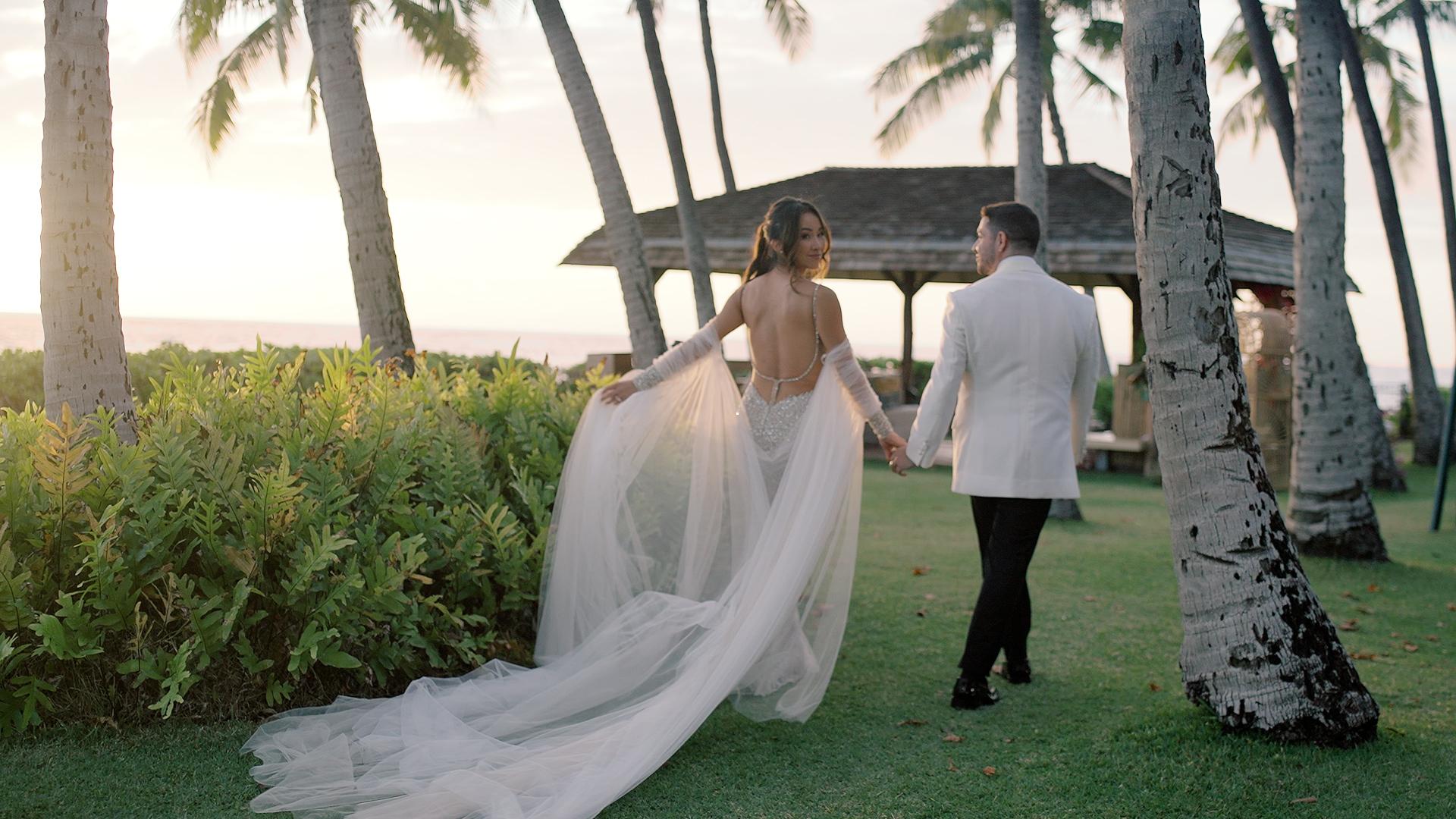 Hawaiian Bride and Groom Walking towards the sunset on their wedding day